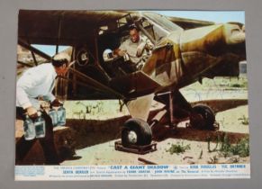 An autographed 'Cast a Giant Shadow' lobby card signed by Frank Sinatra.