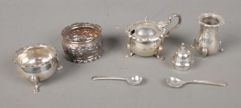 A small collection of assorted silver to include mustard pot, napkin ring, several mustard spoons,