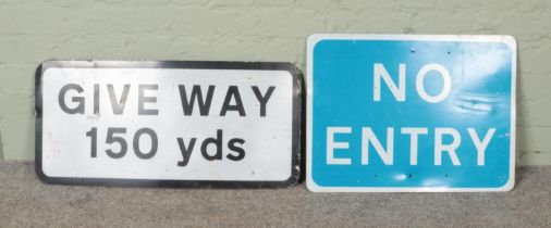 Two modern road signs to include blue No Entry and reflective Give Way examples.