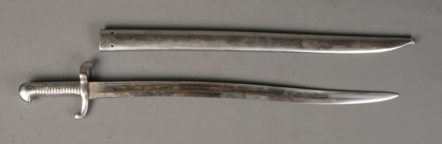 An 1842 pattern Chassepot bayonet with scabbard and engraving to top edge of blade. Handle has