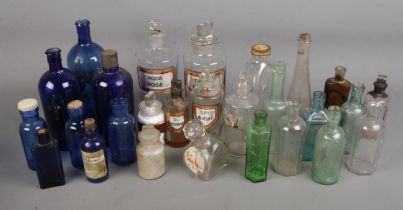 A collection of late 19th/early 20th century apothecary and chemist bottles. Some examples chipped