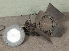 A vintage Berkey Technical (formerly Colortran) Fresnel stage light with barn doors along with a