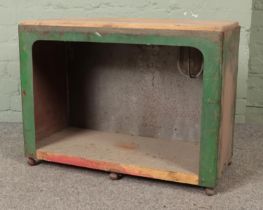 A scratch build wooden and metal framed standing floor cabinet with industrial style interior light.