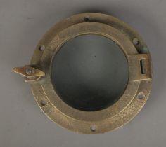 A small brass ships porthole. Approx. diameter 20.5cm.