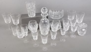 A good collection of Waterford crystal. Includes decanter, two brandy glass, wine glasses, etc.