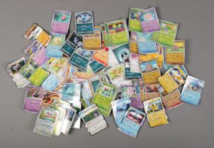 A quantity of Pokemon cards including several holographic examples. Over 110 cards