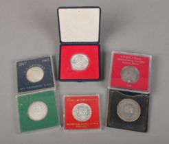 A collection of silver coins including Canada Confederation, Polish 50zl Fryderyk Chopin, JFK Half