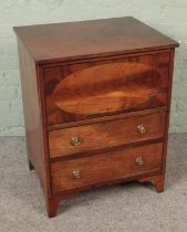 An early 20th century mahogany inlaid commode with hinged top over two faux drawers. Hx74cm Wx58cm