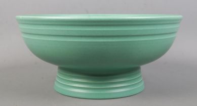 Keith Murray for Wedgwood; an Art Deco footed bowl in matt green. Stamped to the base. Diameter:
