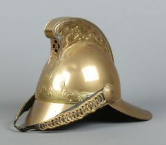 A brass Merryweather fire helmet for the Metropolitan Fire Brigade.