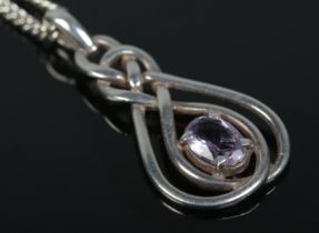 A silver and amethyst pendant on silver chain by Malcolm Gray for Ortak.