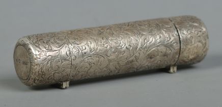 A Victorian double ended silver scent bottle of cylindrical form with engraved decoration. One end