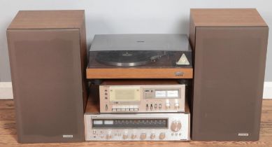 A Hitachi hifi stacking system. Includes stereo receiver, turntable, pair of speakers, etc.