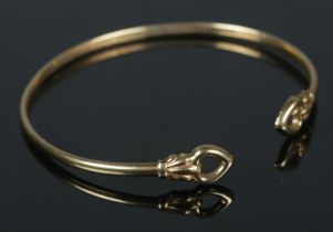 A 9ct gold bangle. 3.49g