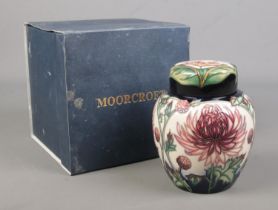 A Moorcroft pottery ginger jar decorated in the Chrysanthemum design from The Connoisseur Collection