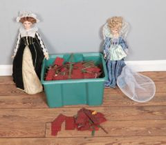A large box of assorted Meccano pieces along with two porcelain dolls including Alberon Mary Queen