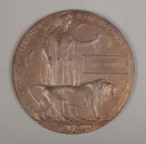 A World War One bronze memorial plaque/death penny awarded to James Newton. In original box.