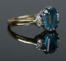 An 18ct gold sapphire and diamond ring. Assay mark for 1987. Size I 1/2. 3.08g.