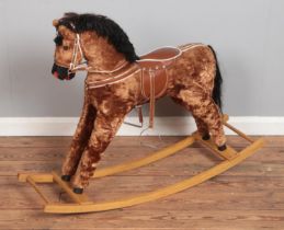 A vintage plush rocking horse.
