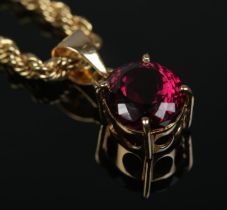 A Chopard 18ct gold rope twist necklace with red stone pendant. Stamped LUC 750 and signed