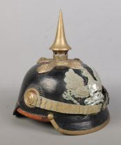 A World War One Imperial German officers pickelhaube. Bearing eagle badge with motto Mit Gott Fur