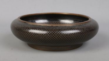 An early 20th century Chinese bronze bowl. Having scaled decoration, central motif and bearing