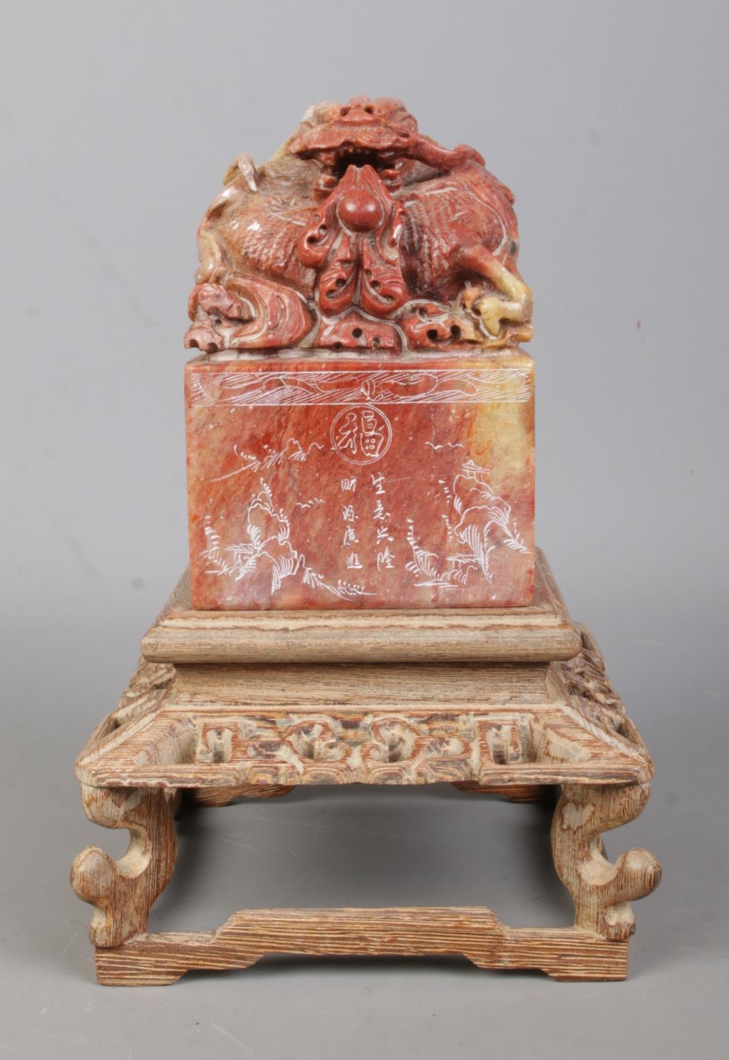 A Chinese carved soapstone seal raised on carved wooden stand. The seal surmounted with a Qilin - Image 2 of 7