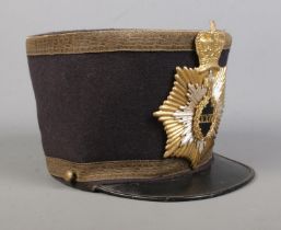 A Victorian military style shako. The inside stamped for William Mutrie & Son.