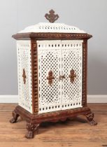 An enamel cast iron stove with lion paw feet and urn shaped finial. Height 102cm, Width 59cm,