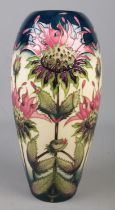 A Moorcroft pottery vase decorated in the Bergamot pattern by Vicky Lovatt. Date cypher for 1999.