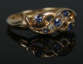 An early 20th century 18ct gold sapphire and diamond intertwined snake ring. Hallmarks for