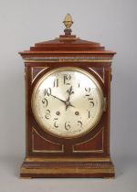 A Winterhalder & Hofmeier mahogany bracket clock. Having acorn finial, twin brass loop handles,