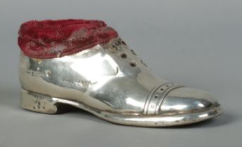 A George V silver pin cushion formed as a shoe. Assayed Birmingham 1920 by S Blanckensee & Son