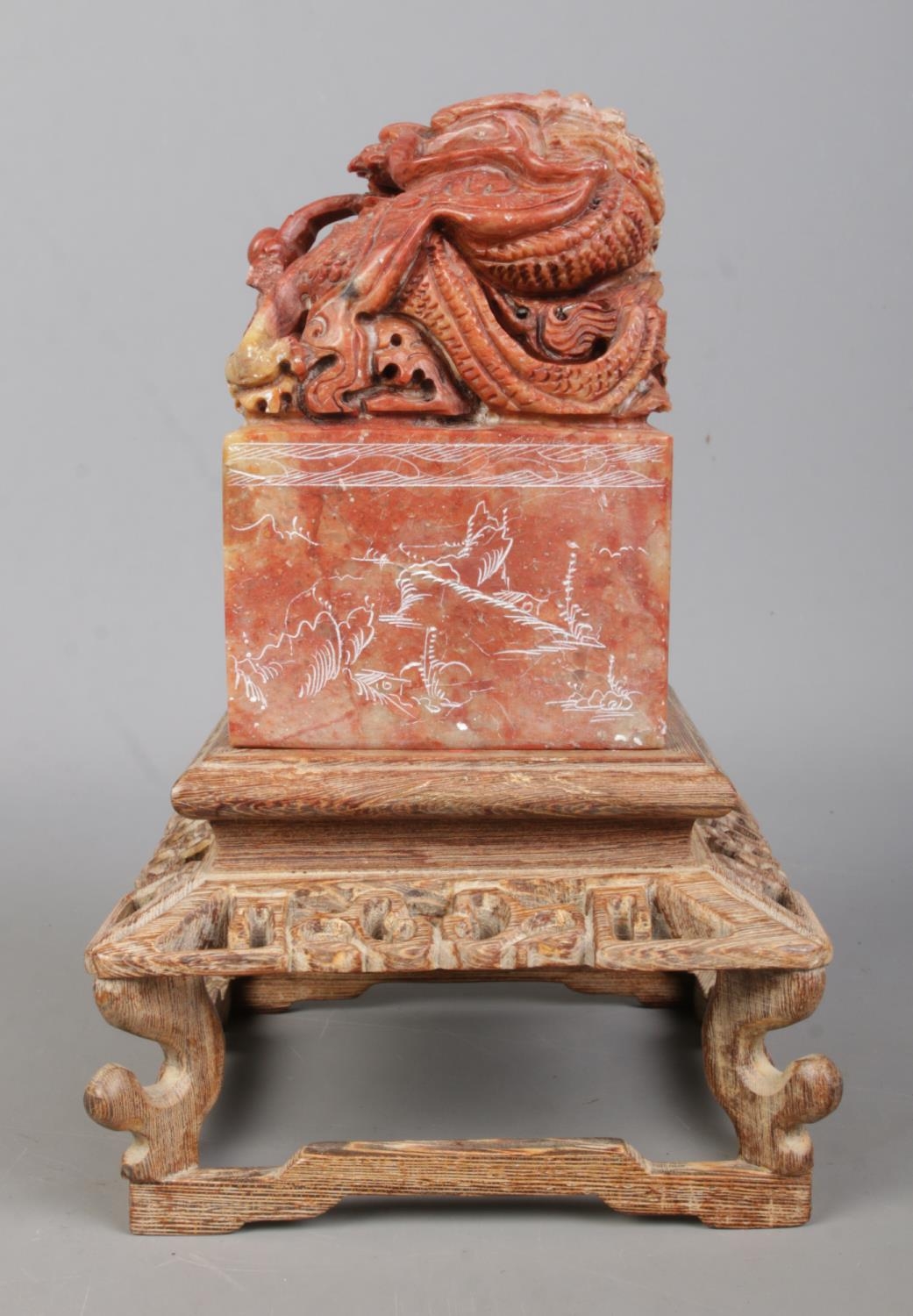 A Chinese carved soapstone seal raised on carved wooden stand. The seal surmounted with a Qilin - Image 5 of 7