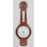 A carved mahogany Aneroid barometer. 64cm