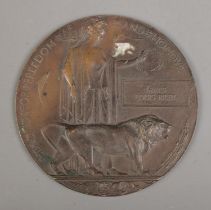 A World War One bronze memorial plaque/death penny awarded to James Louis Riley.