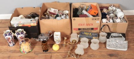 Four boxes of miscellaneous. Includes silver plate teapot, pair of Noritake vases, light fittings,