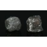 Two rough uncut diamonds. Approx. 1ct total