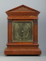 A Winterhalder & Hofmeier carved oak bracket clock. Having square brass dial and Roman numeral