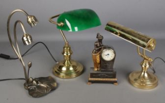 A collection of desk lamps including bankers lamp and modern decorative clock.