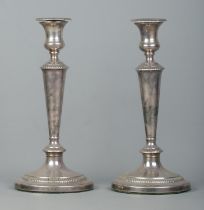 A large pair of George III candlesticks with detachable nozzles. Assayed Sheffield 1809 by John