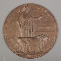 A World War One bronze memorial plaque/death penny awarded to Frank Pilling.