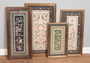 Four framed Chinese silks depicting flowers and birds. Largest example 75cm x 42cm.