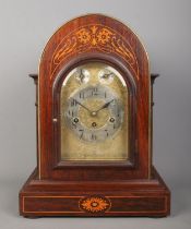 A Junghans inlaid mahogany bracket clock. Having brass dial and subsidiary dials for speed and