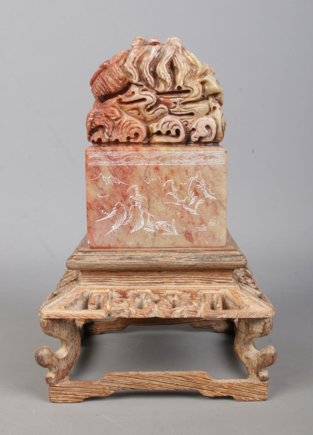 A Chinese carved soapstone seal raised on carved wooden stand. The seal surmounted with a Qilin - Image 4 of 7