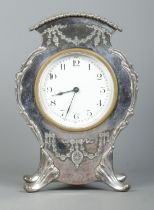 An early 20th century Lloyd, Payne & Amiel silver plated mantel clock, housing French 8 day