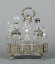 A Victorian silver and cut glass eight bottle cruet set. Assayed London 1843 by John Angell II &