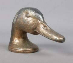 A cast metal novelty bottle opener formed as a Mallard head, titled 'Ducky' by Kirby, Beard & Co,