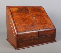 A Victorian walnut and mahogany desk tidy with fitted interior and perpetual calendar. Height