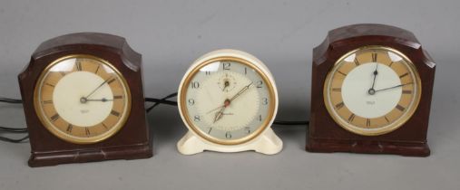 Three vintage bakelite electric clocks to include Genalex and two Smith's Sectric examples.